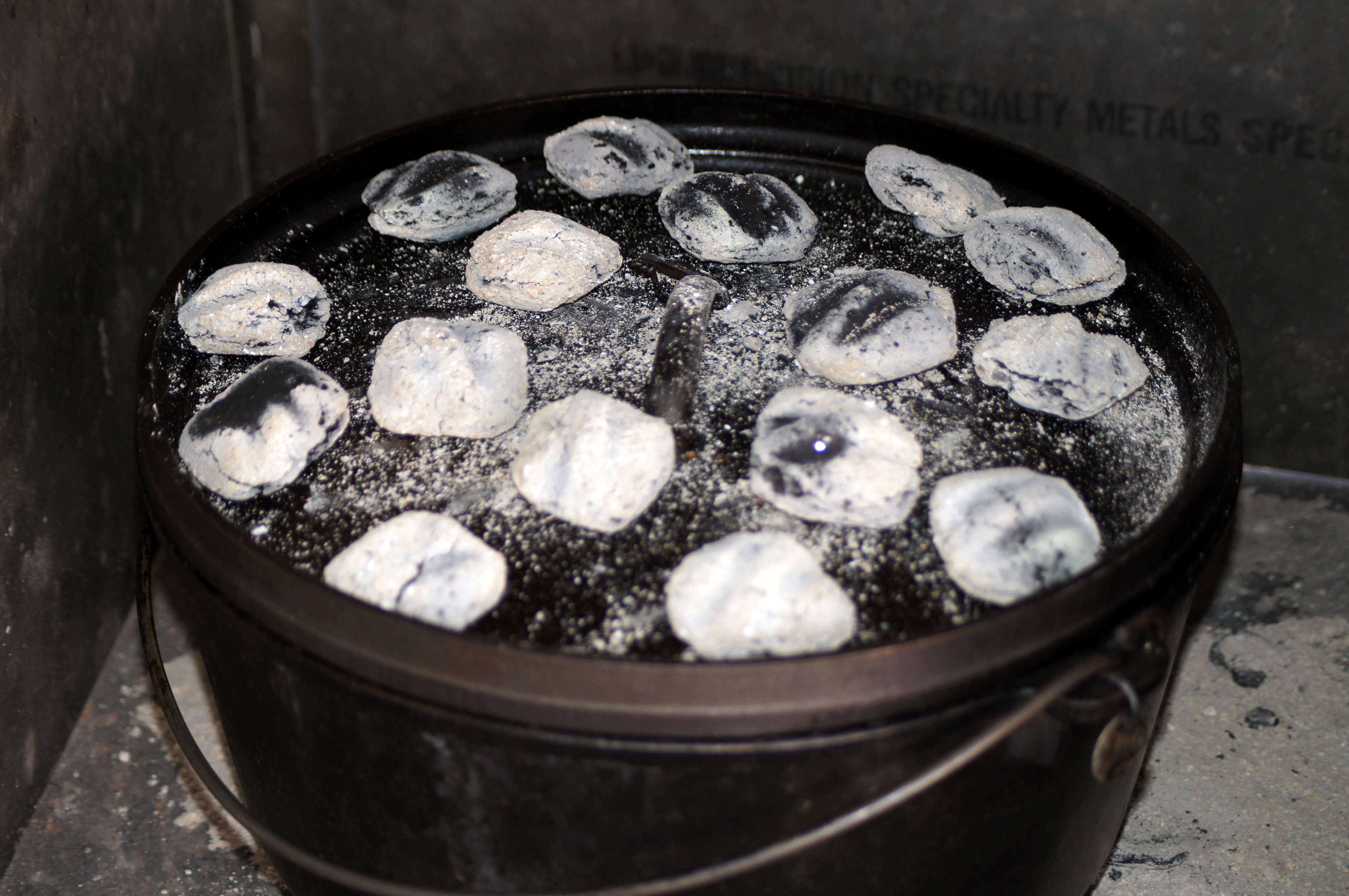 Why do some people put coals in the lid of a Dutch oven whilst